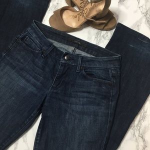 Joe’s Jeans dark wash with detailed pockets.